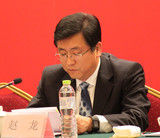 国土资源部党组成员、副部长赵龙在中国土地学会第七次全国会员代表大会上宣读姜大明批示